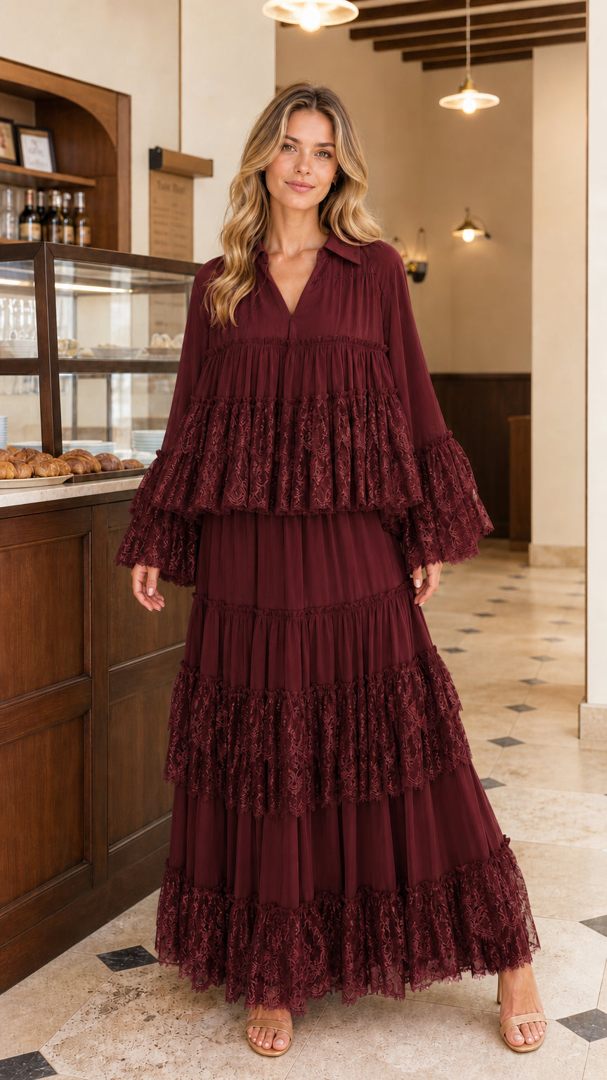 Front view of model wearing burgundy tiered lace maxi dress