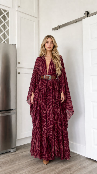 Woman wearing burgundy wine colored animal print kimono maxi dress