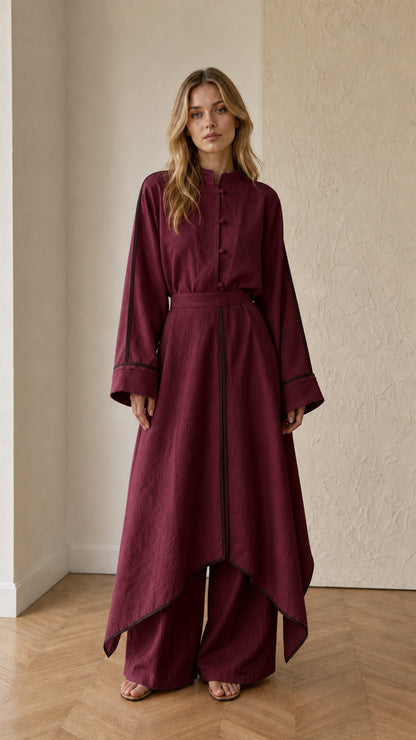 Full front view of burgundy wine red asymmetrical tunic and wide-leg trousers set