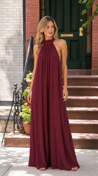 Woman wearing burgundy wine red halter neck wide leg jumpsuit