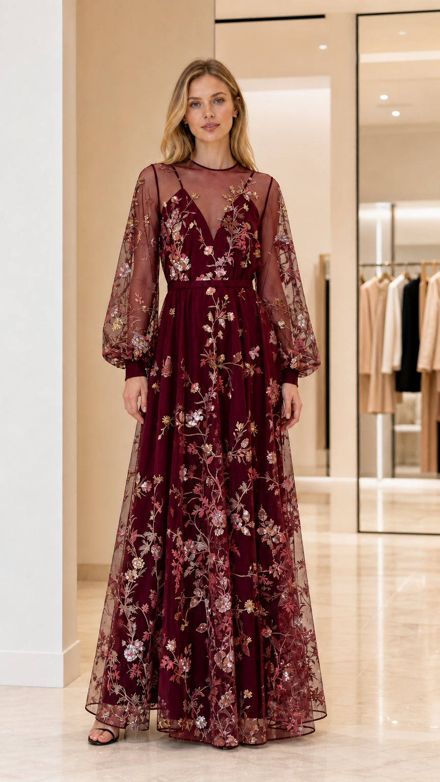 Front view of woman wearing burgundy embroidered maxi dress