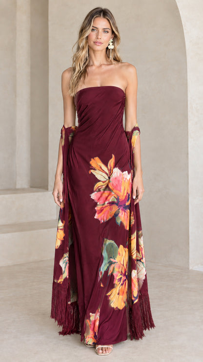 Burgundy strapless maxi evening dress with colorful floral print and fringe shawl