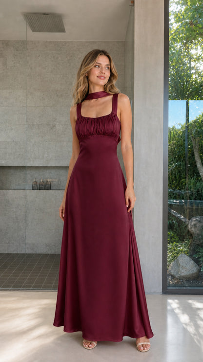 Model wearing Burgundy satin ruched bust maxi dress front view