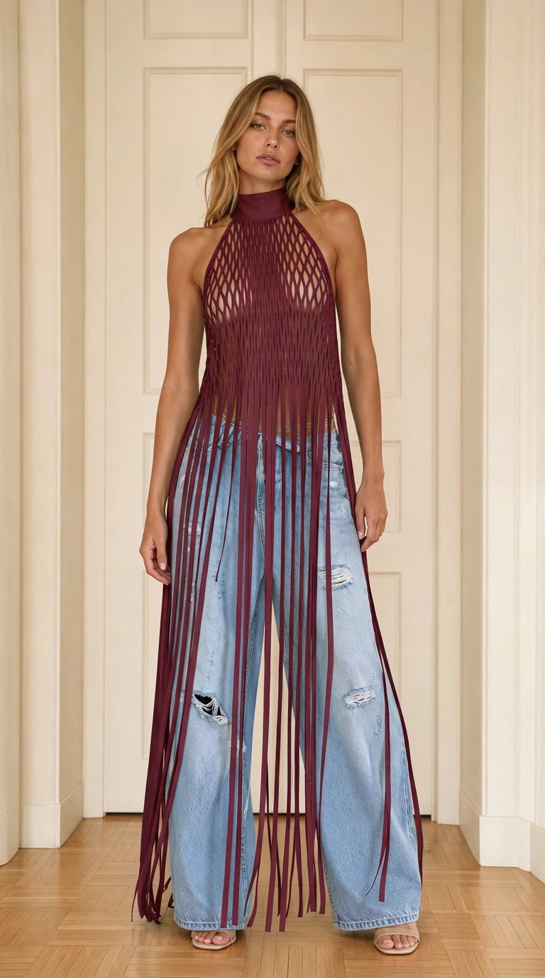 Model wearing burgundy halter neck cutout fringe long top