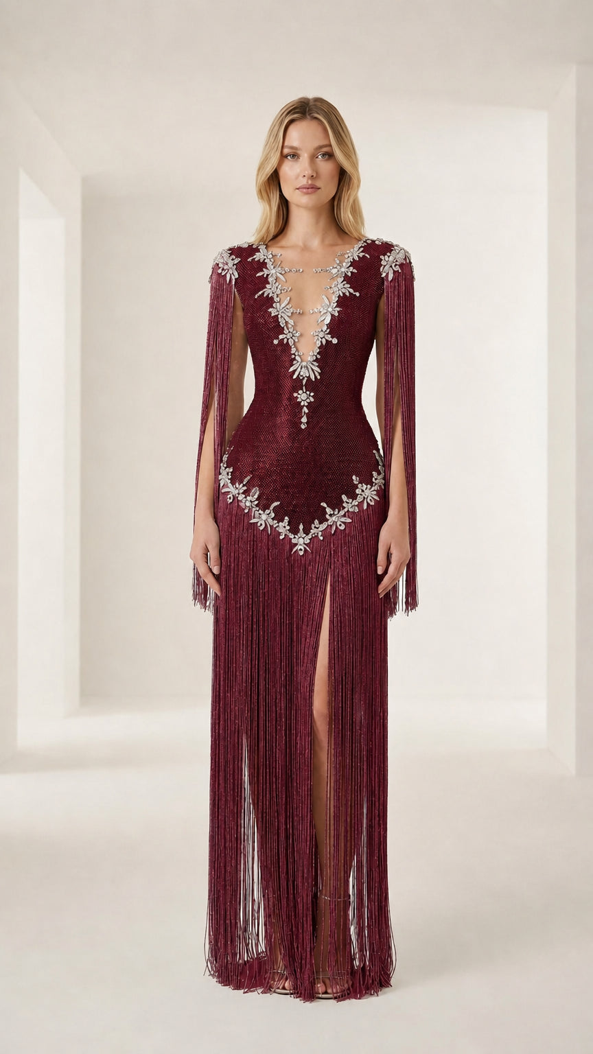Front view of model wearing a burgundy crystal-embellished fringe evening gown