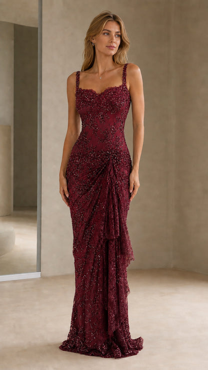 Front view of model wearing burgundy beaded evening gown