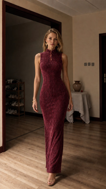 Full view of model in burgundy metallic maxi dress