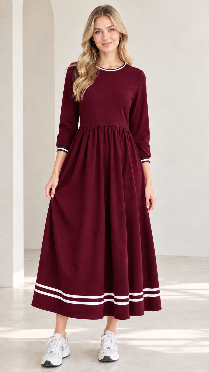 Front view of model wearing burgundy wine red 3/4 sleeve maxi dress with white striped trim