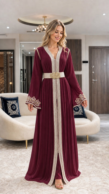 Front view of burgundy wine pleated caftan maxi gown with belt