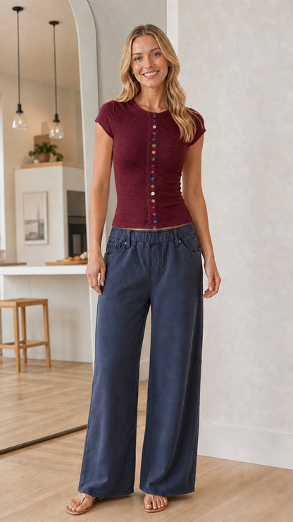 Full-body view of a model wearing a burgundy wine red short sleeve fitted top