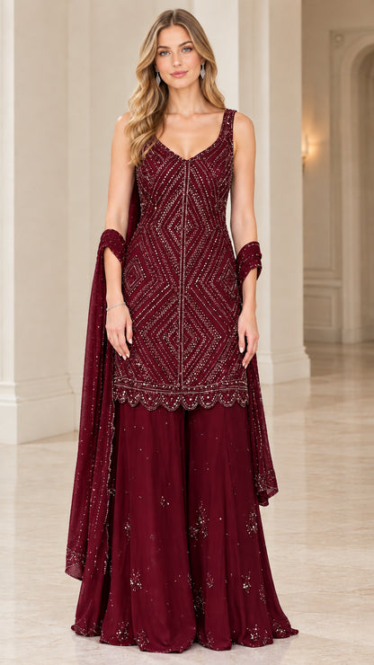 Model wearing Burgundy wine beaded kurti and flared sharara pants set