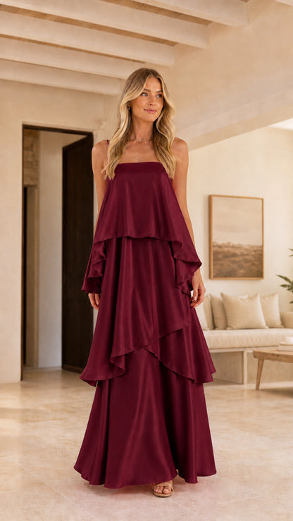 Model wearing burgundy wine tiered ruffle satin maxi dress