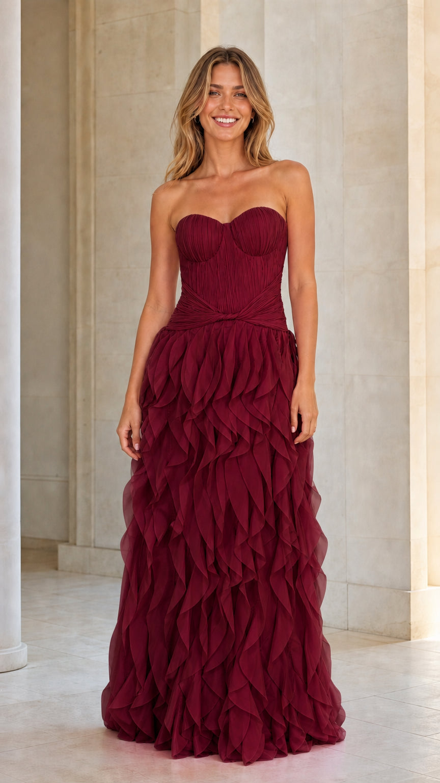 Model wearing burgundy red strapless tiered ruffle maxi dress