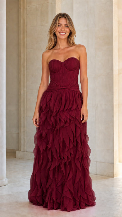 Model wearing burgundy red strapless tiered ruffle maxi dress