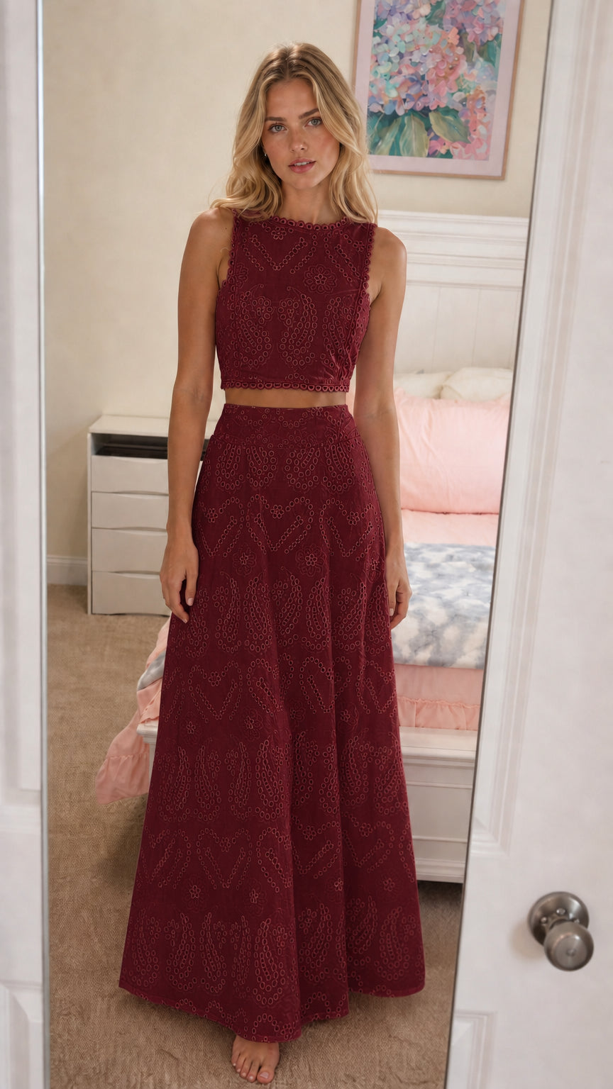 Front view of model wearing burgundy eyelet two-piece set