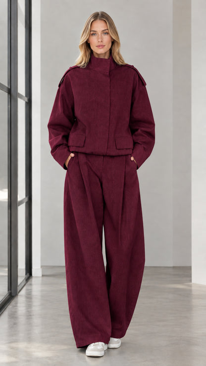 Full front view of woman wearing Burgundy cropped jacket and wide leg trousers set