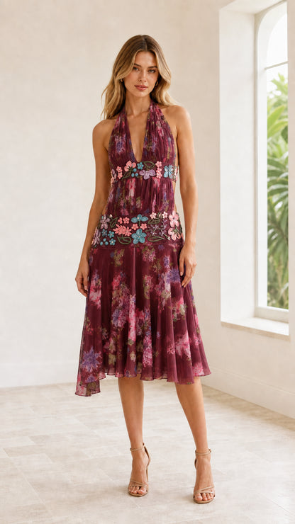 Front view of model wearing Burgundy wine floral halter cutout midi dress