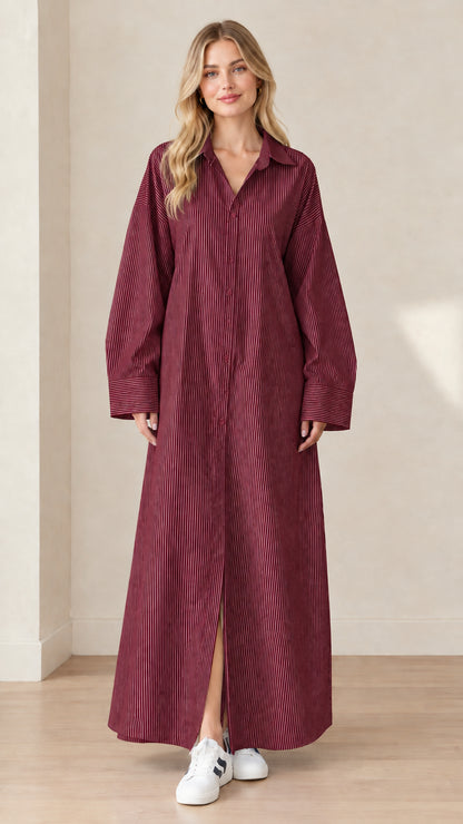Front view of a model wearing a burgundy wine red and white striped maxi shirt dress