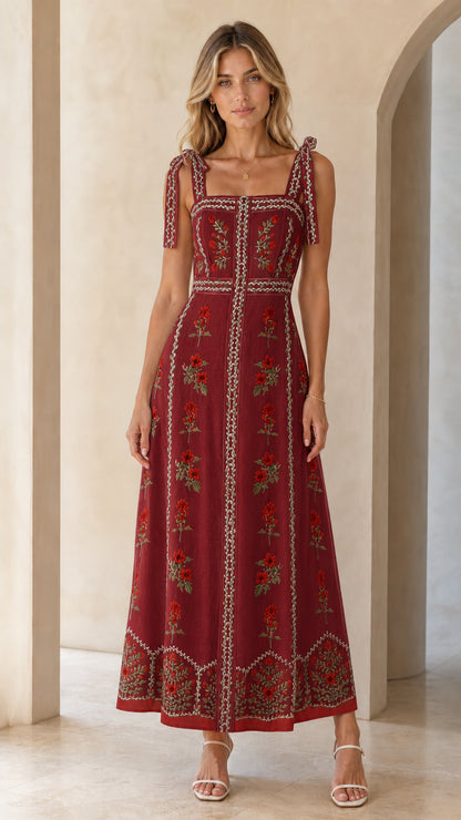 Woman wearing burgundy variant of the floral embroidered maxi dress