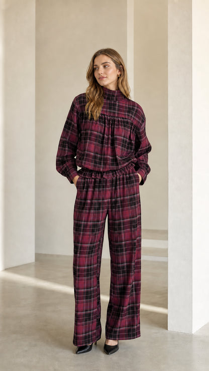Model wearing burgundy wine plaid long sleeve top and wide leg trousers set