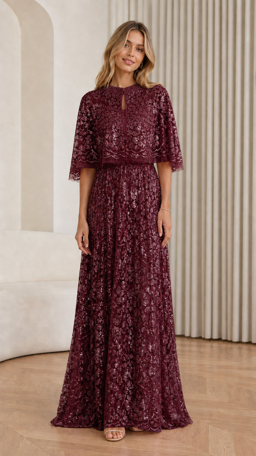 Front view of Burgundy sequin cape maxi dress on model