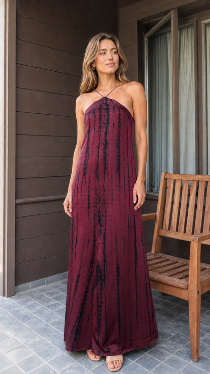 Front view of burgundy tie-dye halter maxi dress