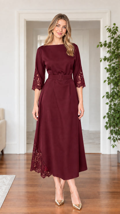Front full-length view of woman wearing burgundy lace trim belted midi dress