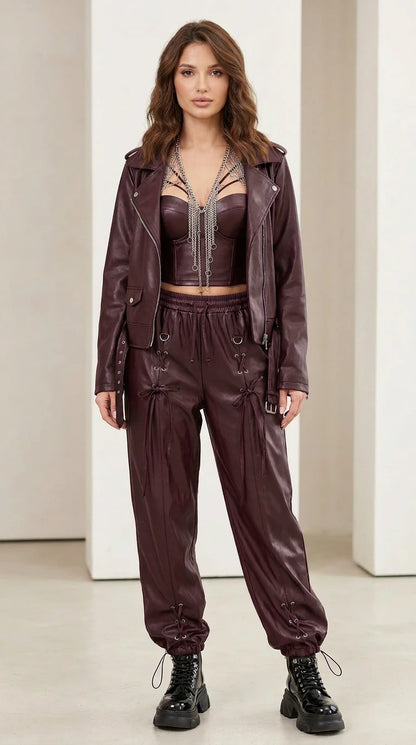 Model wearing burgundy faux leather matching set
