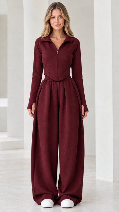 Full-length front view of model wearing burgundy red quarter-zip top and wide-leg pants set