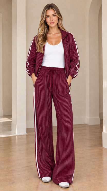 Model wearing rich burgundy wine striped tracksuit set with drawstring pants