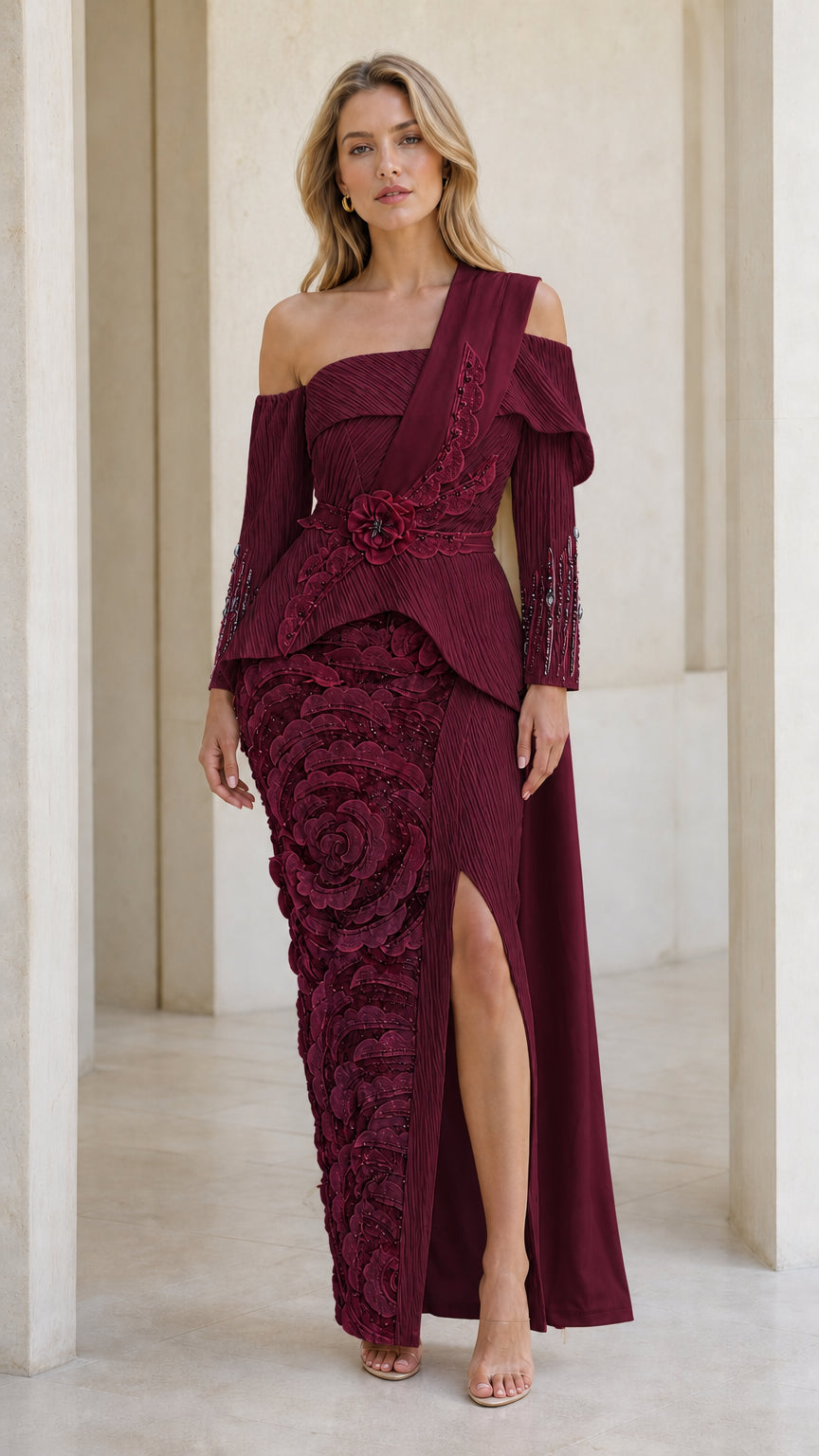Front full view of burgundy evening gown with side slit and floral texture