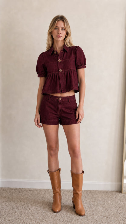 Model wearing burgundy denim matching set