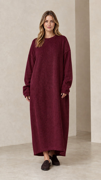 Woman wearing burgundy wine red ribbed knit oversized maxi dress