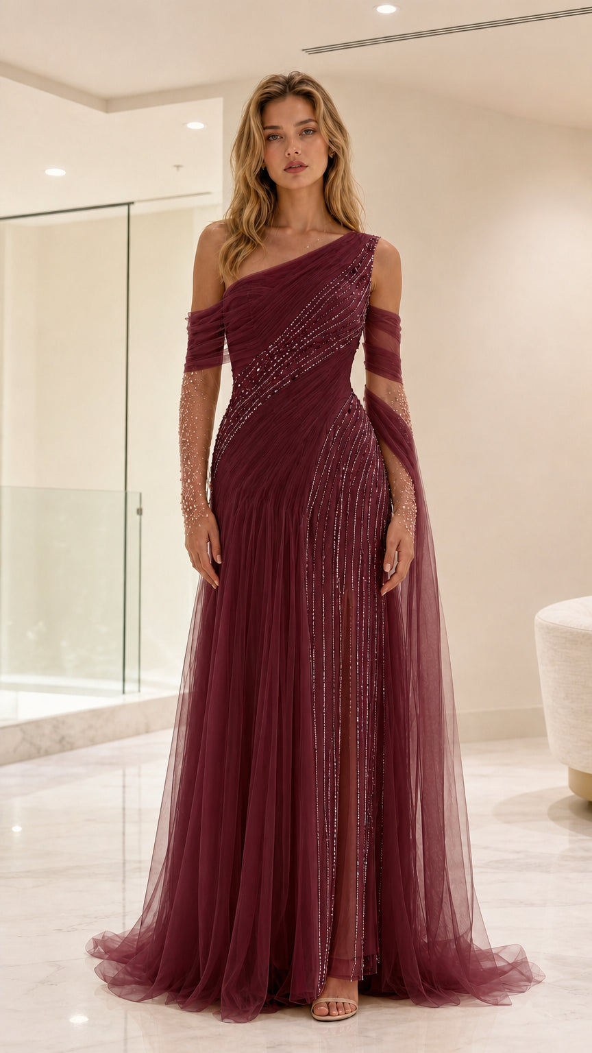 Front view of burgundy red one-shoulder sequin tulle evening gown with draped sleeves