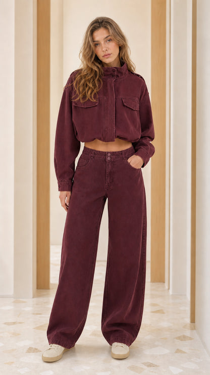 Model wearing Burgundy cropped utility jacket and matching wide-leg pants