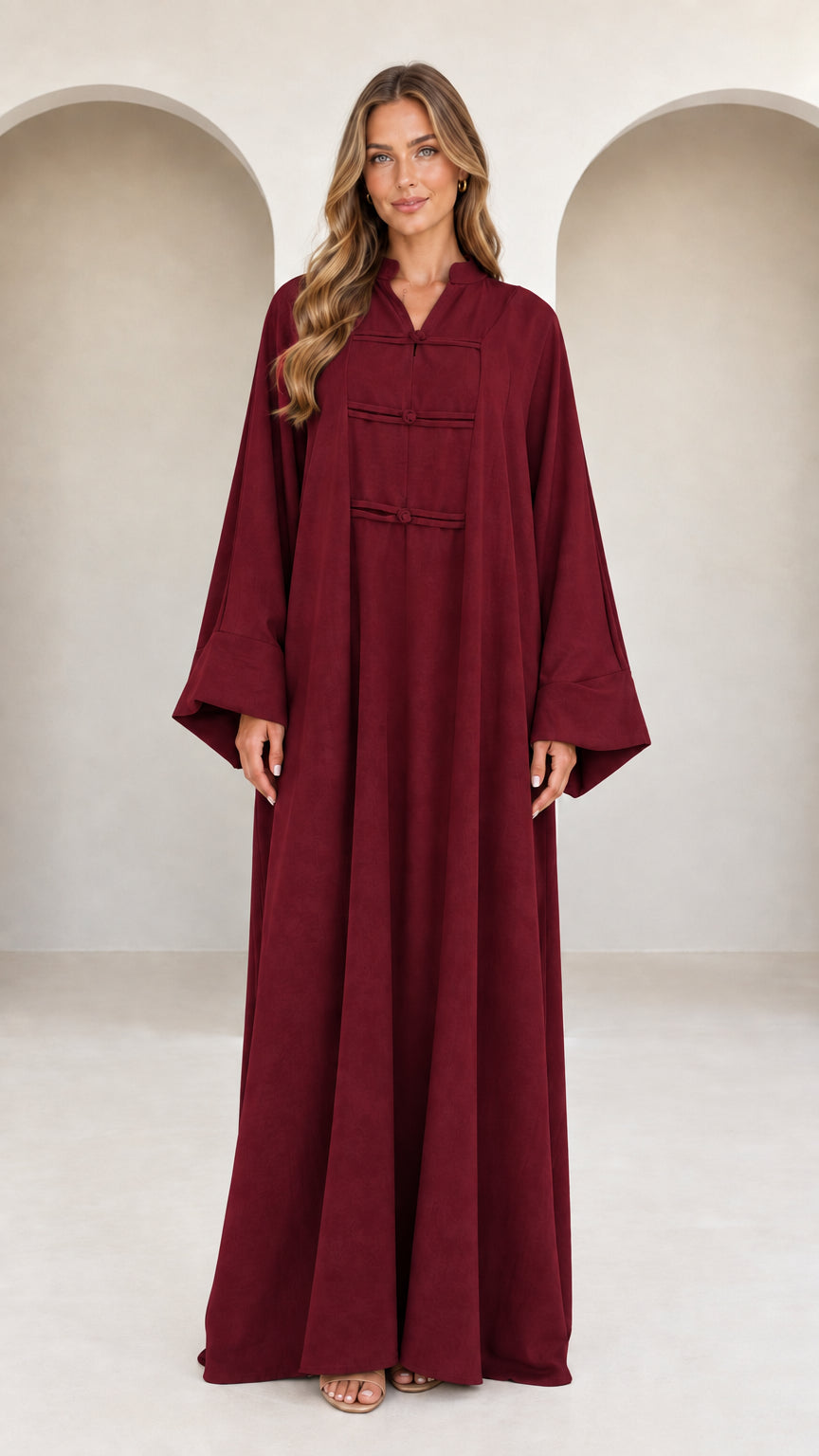 Front view of model wearing burgundy wine red long sleeve frog button maxi dress