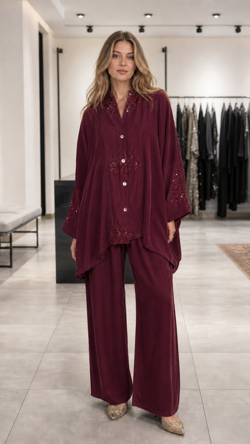 Model wearing burgundy embroidered lounge set