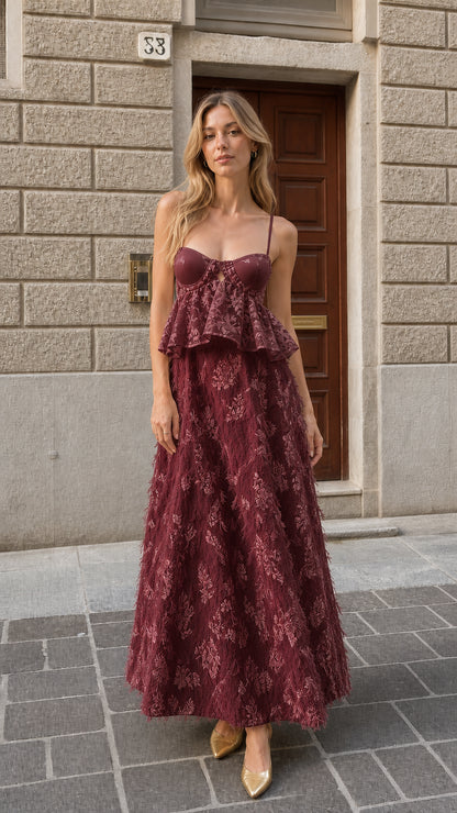 Full-length view of burgundy wine red bustier feather maxi dress
