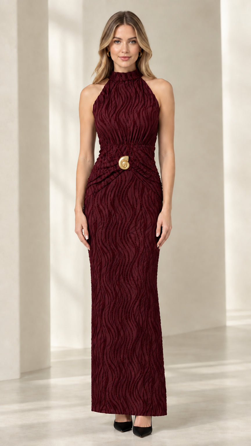 Front view of woman wearing burgundy wine red textured halter evening gown