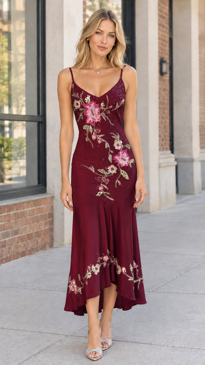 Front view of burgundy floral embroidered slip midi dress with asymmetrical hem