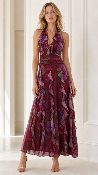 Front view of model wearing burgundy floral halter ruffle maxi dress