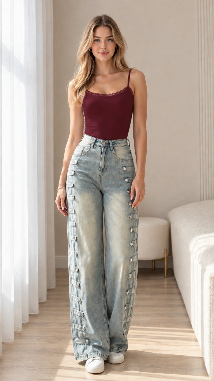 Front view of light blue wide-leg jeans styled with a burgundy camisole top