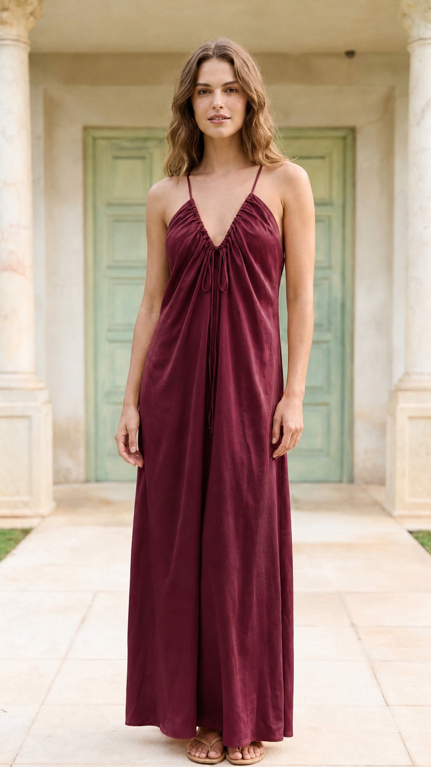 Model wearing burgundy spaghetti strap maxi dress
