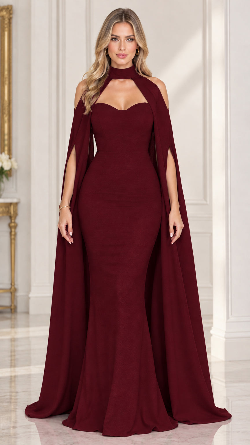 Front view of woman wearing burgundy wine red cape sleeve mermaid gown