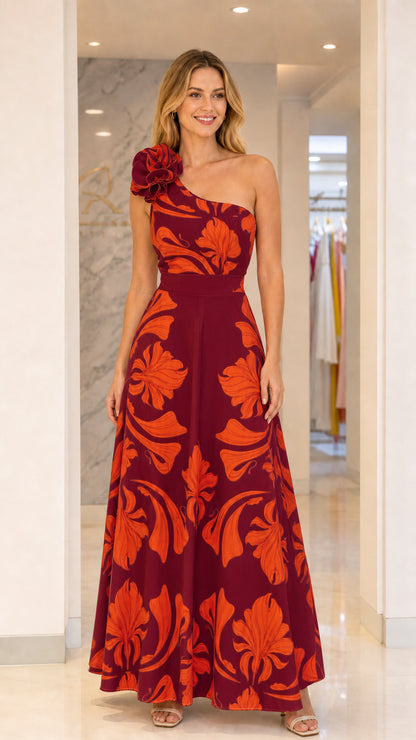 Model wearing burgundy and orange floral one-shoulder maxi dress