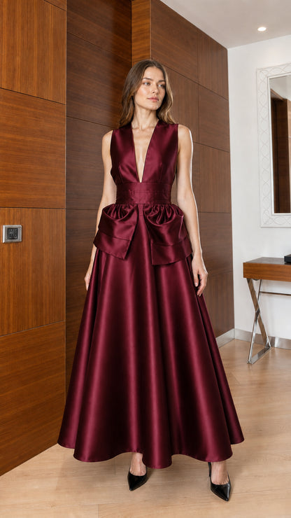 Front view of burgundy satin maxi dress with waist bow