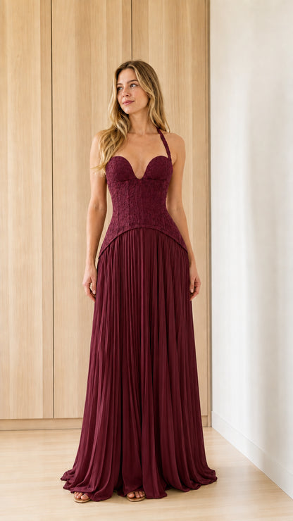 Front view of burgundy halter lace bodice pleated maxi dress