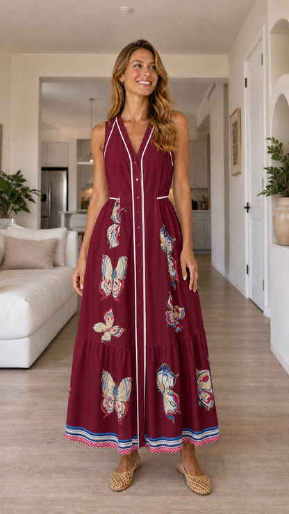 Woman wearing burgundy butterfly print maxi dress