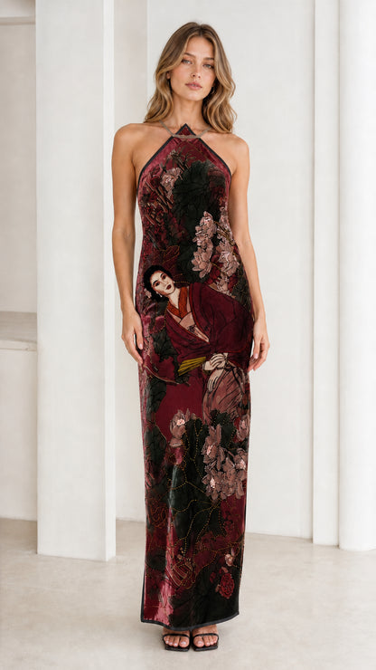 Model wearing burgundy velvet halter maxi dress
