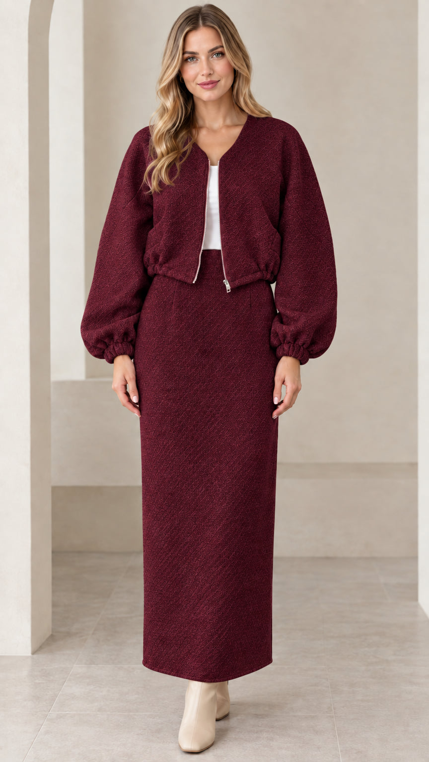 Full-length front view of burgundy textured cropped jacket and maxi skirt set